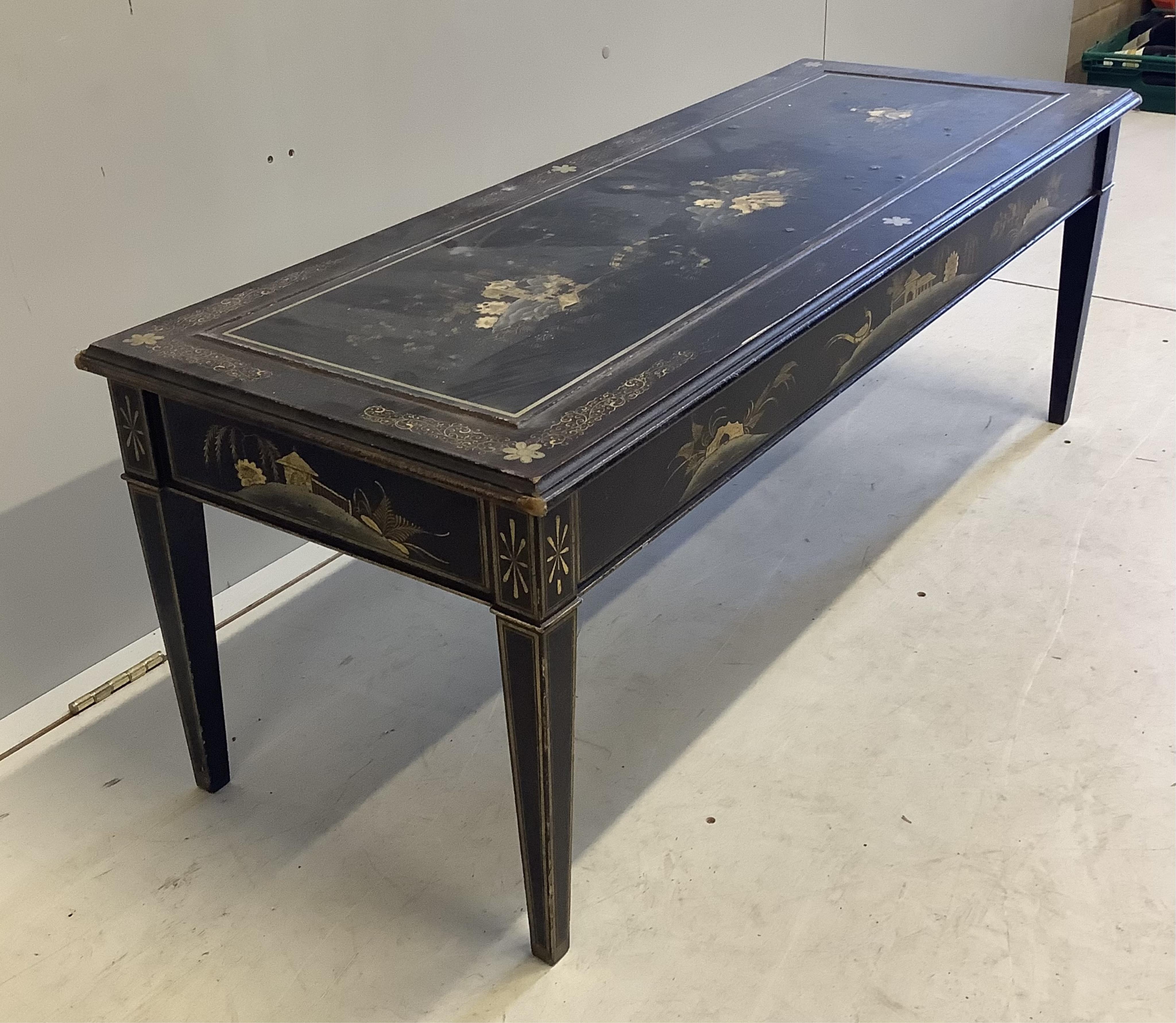 A rectangular black lacquered coffee table, width 120cm, depth 46cm, height 44cm. Condition - poor to fair